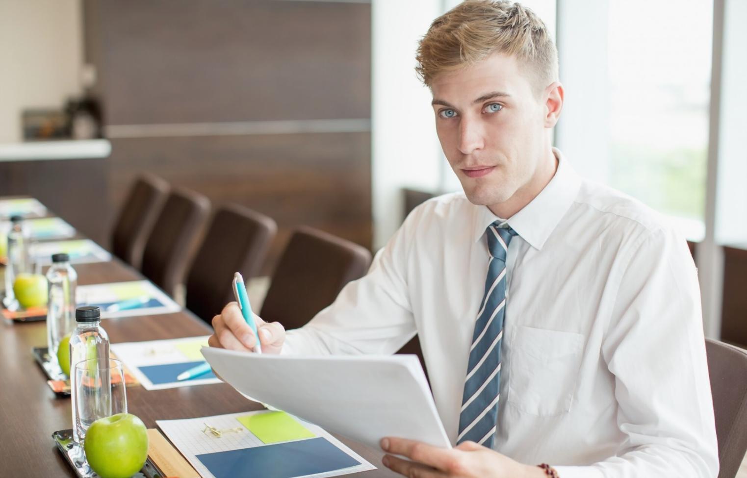 Budget planning session with real financial documents and notebooks